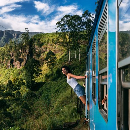 Beautiful,Girl,Traveling,By,Train,Among,Mountains.,The,Girl,Travels